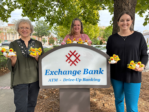 Exchange Bank Team Holding Rubber Ducks - Rubber Duck Hunt Exchange Bank Team Holding Rubber Ducks